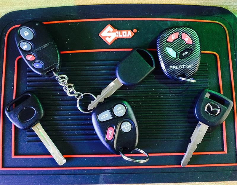 a variety of automotive key fobs and remotes